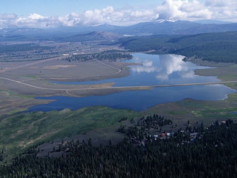 An aerial view of Martis Creek Lake on a summer day.